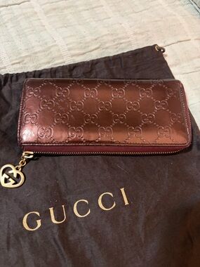 Gucci Metallic Burgundy GG-Embossed Zip Wallet with Gold Charm